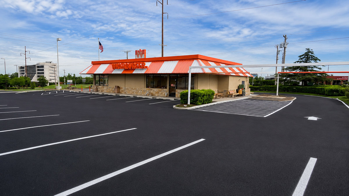 Freshly resurfaced and striped Whataburger parking lot in Tulsa, Oklahoma by Kingdom Paving