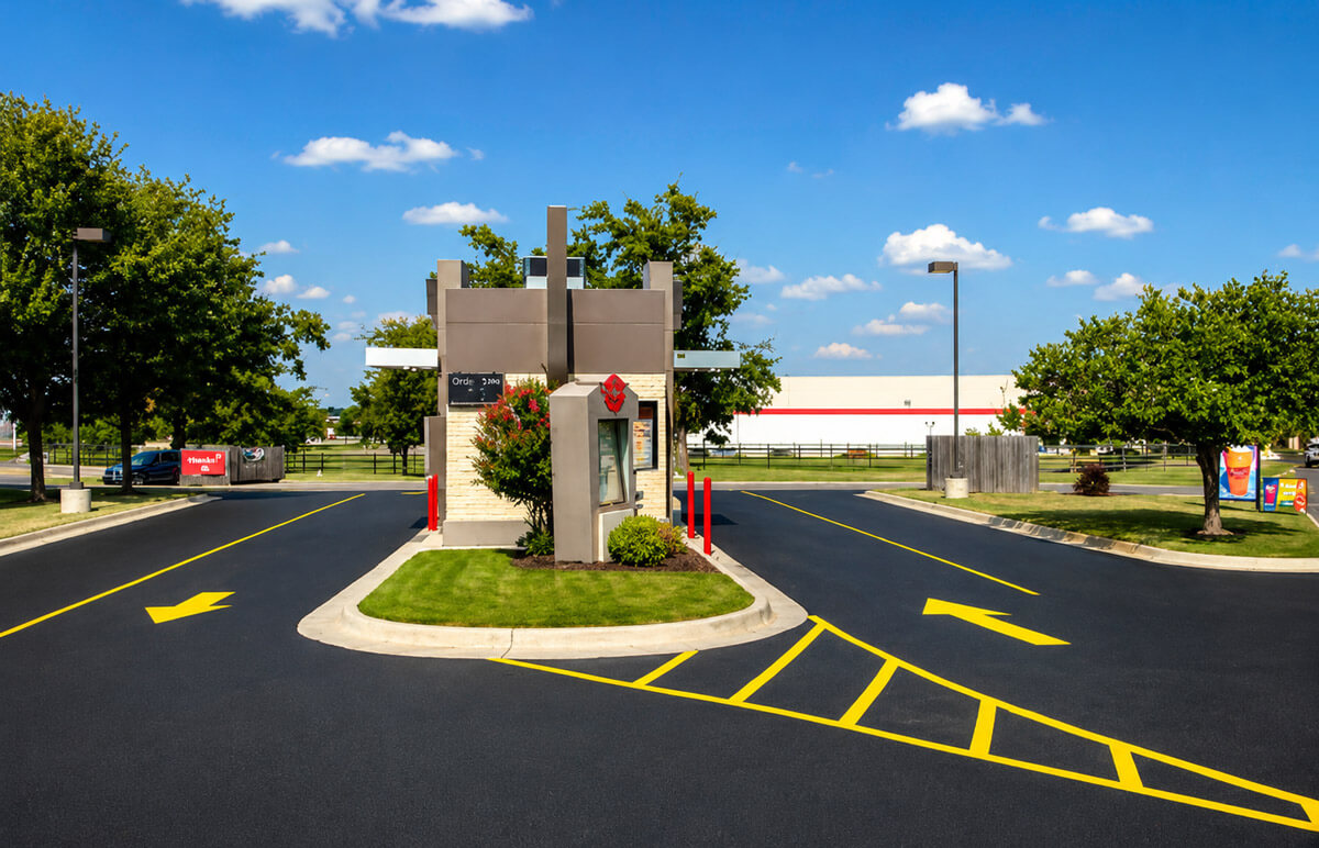 Freshly resurfaced and striped drive-thru coffee shop parking lot in Tulsa, Oklahoma by Kingdom Paving